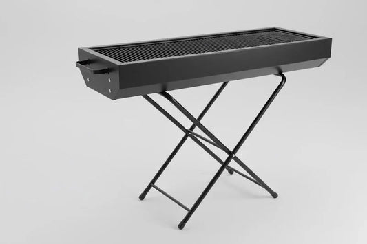 Foldable charcoal BBQ grill by CSSV FILE, compact and portable with metal grilling surface and foldable legs for easy transport.