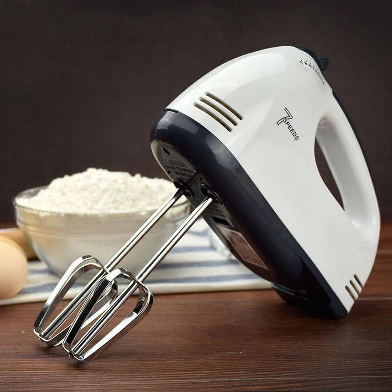 CSSV FILE Super Hand Mixer with stainless steel beaters and ergonomic handle for easy mixing and baking.